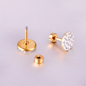Macro view of gold round stud earrings with pave crystals and secure screw back closure