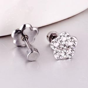 Close-up of five-petal flower stud earrings with sparkling crystals and screw-back detail