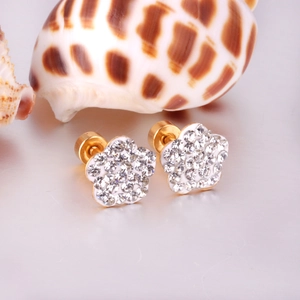 Detail of white flower stud earrings with sparkling rhinestones and screw back