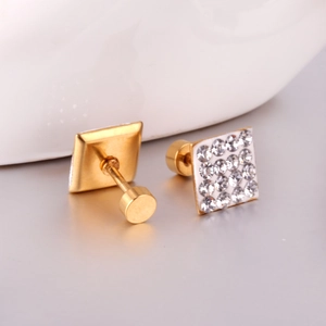 Macro view of gold plated square stud earrings featuring clear crystal stone inlays