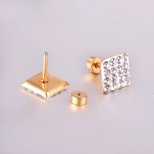 Detail of square screw back earrings featuring clear zircon stones and gold finish