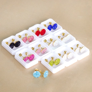 Multiple colors of round clay flower stud earrings with crystals in gold finish