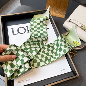 Green checkerboard twilly scarf with yellow smiley faces and NICE lettering design