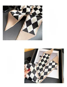 Detail of argyle pattern silk scarf with premium inner stitching for durability