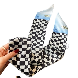 Classic black and white checkerboard twilly scarf with blue gradient and smile pattern