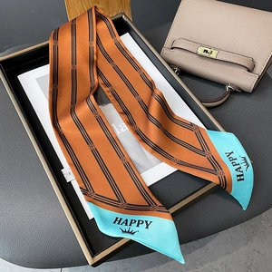 Detail of striped narrow silk scarf with Happy lettering and monogram print