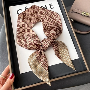 Silk twilly scarf with vintage geometric monogram pattern in brown and caramel tones
