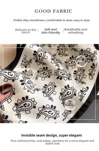 Macro detail of breathable silk-like paisley scarf with fine black stitched edges