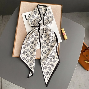Elegant white Paisley long silk scarf tied as a bow for hair or handbag decoration