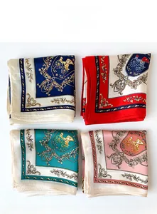 Macro detail of silk-style square scarves featuring classic horse carriage patterns in four colors