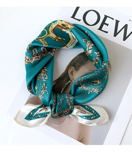 Detailed close-up of retro carriage silk scarf tied as a bow on a fashion magazine