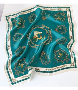 Detailed view of emerald silk scarf featuring vintage carriage pattern and golden vines