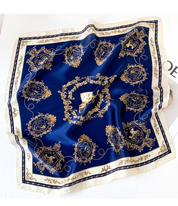 Detailed view of luxury navy blue silk scarf featuring vintage golden carriage patterns