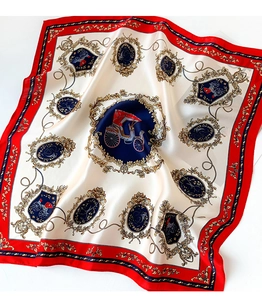 Close-up of vintage carriage pattern on silk scarf with red border and glossy finish