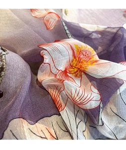 Macro detail of elegant lotus print on semi-transparent lightweight purple silk scarf fabric
