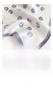Detail of 53x53cm mulberry silk scarf showing smooth texture and elegant purple polka dots