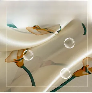 Detail of soft cream faux silk fabric featuring elegant calla lily floral print and satin sheen