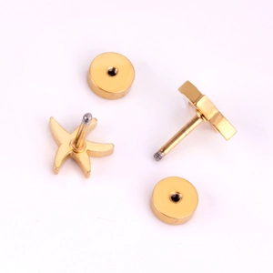Detail of gold starfish earrings featuring a secure screw-back design and threaded posts