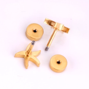 Macro view of gold stainless steel star stud earrings with secure screw-back closures