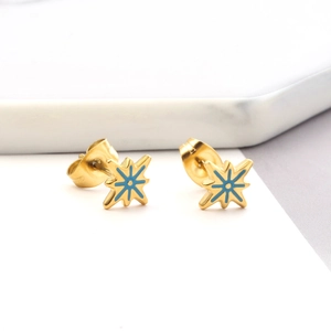 Detail of blue starburst earrings with gold metal base and secure butterfly backing