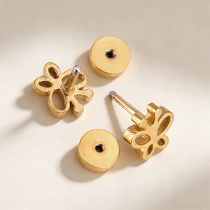 Polished hollow butterfly stud earrings in gold stainless steel with screw backs