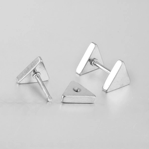 Detail of silver triangle stud earrings featuring secure screw back closure design