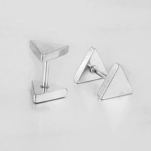 Macro detail of polished stainless steel triangle stud earrings with mirror finish