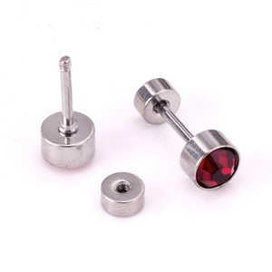 Detail of surgical steel barbell earring featuring red round zircon and screw back closure