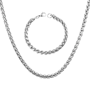 Macro shot of silver wheat chain necklace and bracelet set in polished stainless steel