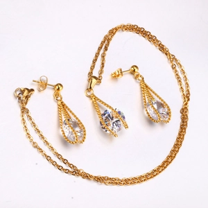 Golden necklace and pear-cut white crystal earrings set in a hollow stainless steel design