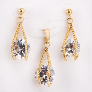 Detail of gold hollow twisted necklace and earrings set with round white zircon stones