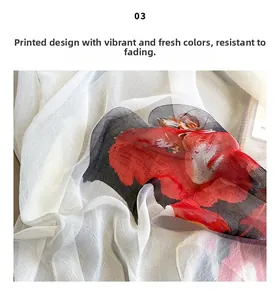 Detailed close-up of floral print on lightweight white semi-transparent chiffon scarf