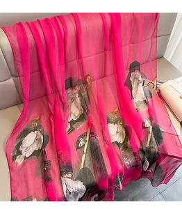 Detailed texture of lightweight pink floral scarf with traditional ink lotus pattern