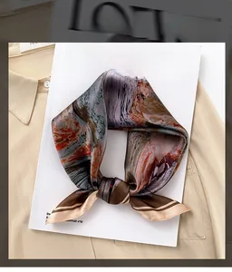 Detailed view of luxury silk scarf with artistic abstract oil painting print and smooth texture