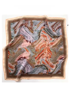 Detailed texture of oil painting style silk scarf with pink and orange abstract patterns