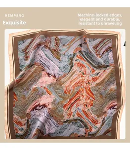 Detail of machine-hemmed edges on a silk scarf with abstract oil painting print patterns