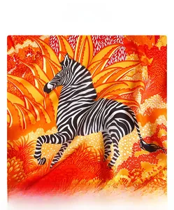 Detailed view of silk scarf fabric showing zebra pattern and premium machine-hemmed edges
