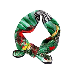 Elegant silk scarf featuring tropical leaves, vibrant floral patterns and zebra prints