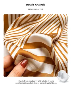 Close-up of premium mulberry silk scarf with classic brown and white striped patterns
