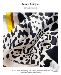 Detail of luxury mulberry silk scarf featuring leopard print and contrast borders