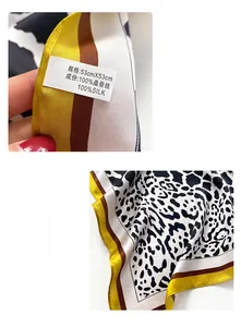 Detailed view of 100% mulberry silk square scarf with leopard print and machine hemmed edge