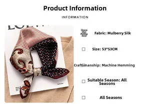 Detailed view of mulberry silk scarf showing paisley patterns and machine hemming texture