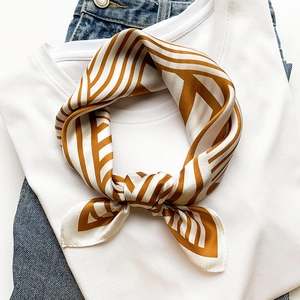 Elegant brown and white striped silk neck scarf styled with a casual white t-shirt