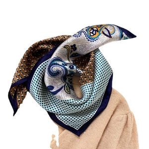 Elegant mulberry silk scarf featuring vintage paisley and geometric patterns on knitwear