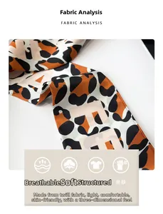Close-up of leopard print skinny scarf in twill fabric showing soft texture and pattern