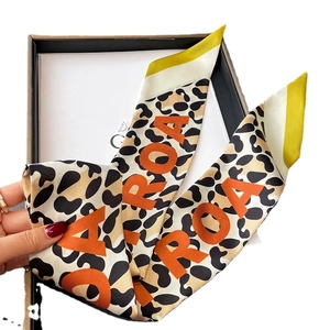 Leopard print skinny silk scarf with orange ROA letters and yellow contrast ends