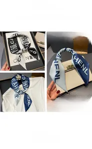 Detailed views of printed silk scarf tied on a handbag and worn as a stylish hair ribbon