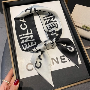 Elegant black and white silk letter pattern skinny scarf presented in a luxury gift box