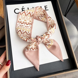 Fashionable narrow silk scarf with geometric wave pattern used as necktie or hair ribbon