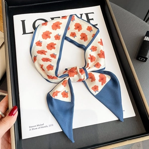 Floral skinny silk scarf for women featuring orange flowers and deep blue trim